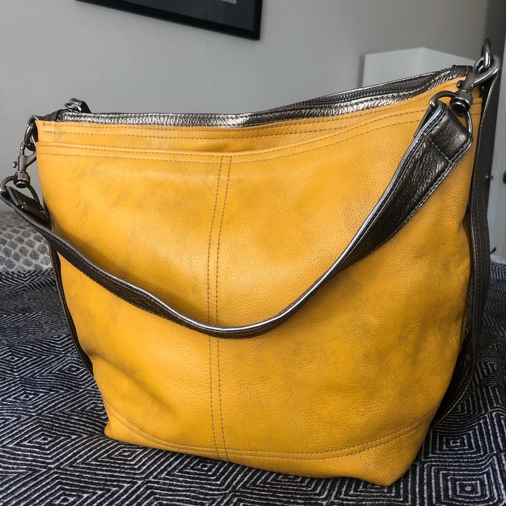 Rough and Tumble Leather Plain Front Hobo Bag with gilding.